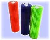Three colorful cylindrical cleaning brushes in red, dark blue, and lime green arranged on a light background