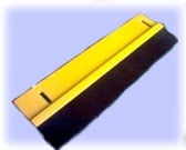 Yellow and black harmonica on light blue background