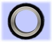Black and gray rubber tire with metallic ring on light blue background