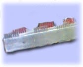 Model cargo ship loaded with colorful shipping containers on blue background