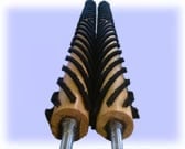 Symmetrical image of a zebras head viewed from behind, showing black and white striped pattern and ears against a light blue background